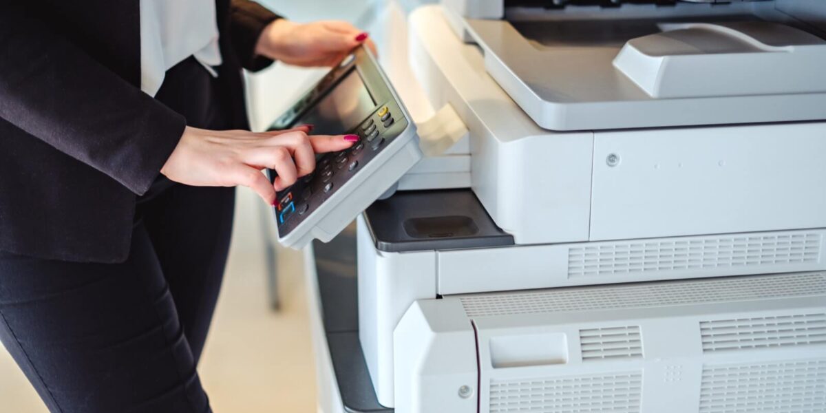 woman-operates-industrial-printer